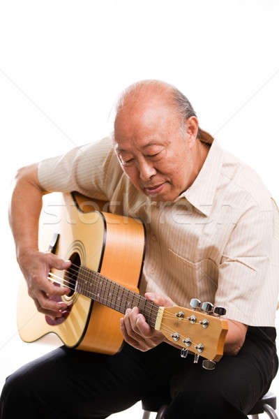 Senior asian playing guitar Stock photo © aremafoto
