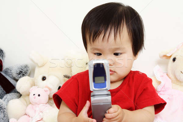 Cute bébé peu jouer téléphone portable Photo stock © aremafoto