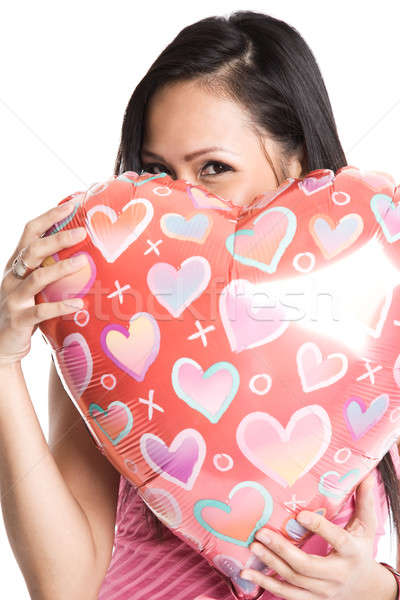 Asian woman hugging heart-shaped balloon Stock photo © aremafoto