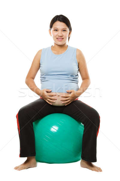 Donna incinta seduta esercizio palla sport bambino Foto d'archivio © aremafoto