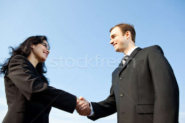 168472_stock-photo-business-people-shake-hands.jpg