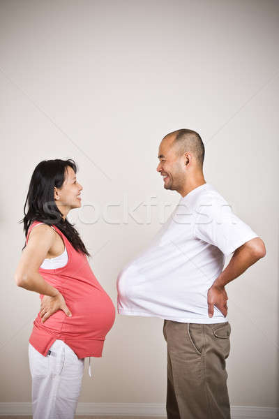 Boldog terhes ázsiai pár szemben család Stock fotó © aremafoto