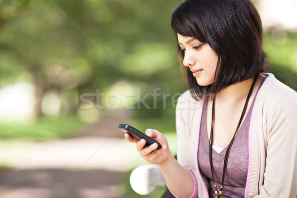 Félvér diák sms chat lövés lány telefon Stock fotó © aremafoto