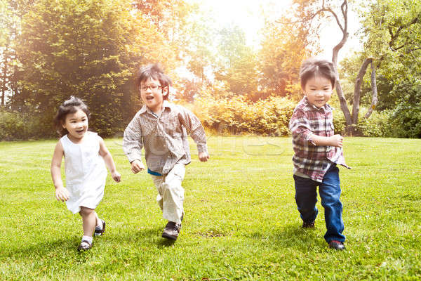 Asian Kinder läuft Park erschossen drei Stock foto © aremafoto