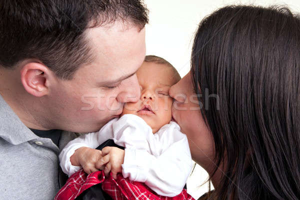 Happy Parents Kiss Their Newborn Baby Stock photo © ArenaCreative