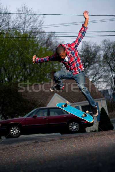 Skateboarder Man Doing a Kick Flip Stock photo © ArenaCreative