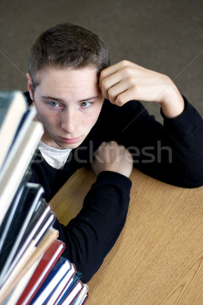 Overloaded Student Looking At Pile of Books Stock photo © ArenaCreative