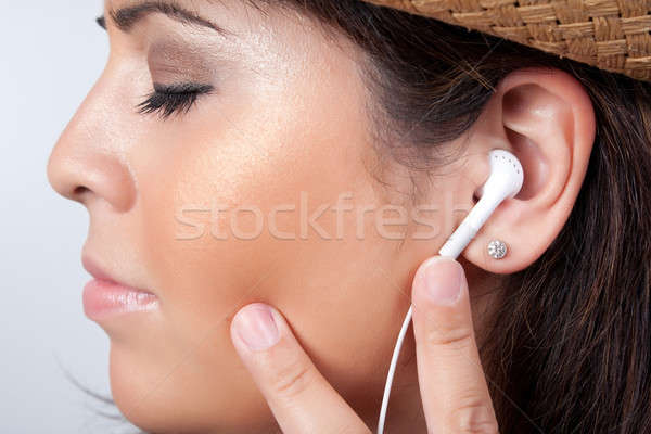 Sztereó fejhallgató vonzó spanyol nő hallgat Stock fotó © ArenaCreative