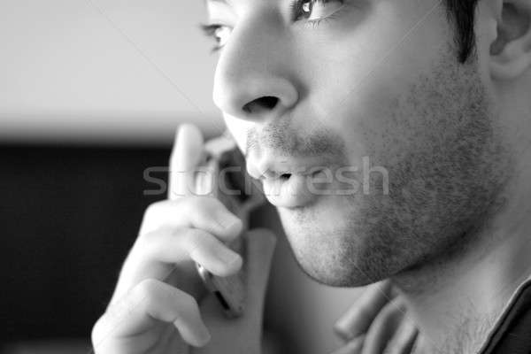 Handy News schwarz weiß Porträt junger Mann Telefon Stock foto © ArenaCreative
