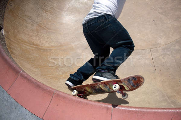 Skateboarder Skating Inside the Bowl Stock photo © ArenaCreative