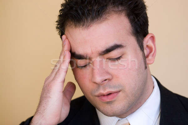 Homme maux de tête jeune homme puissance intense stress [[stock_photo]] © ArenaCreative
