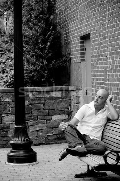 Casual Guy Sitting on a City Bench Stock photo © ArenaCreative