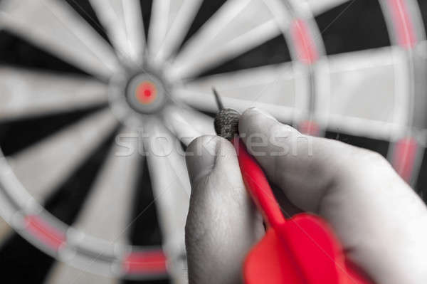 Stock photo: Hand Holding a Dart
