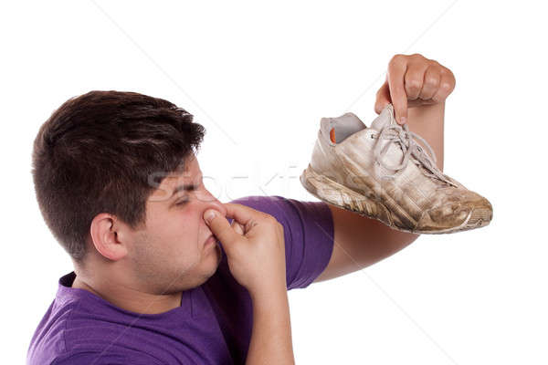 Sportos cipő tinédzser zárva el kéz Stock fotó © ArenaCreative