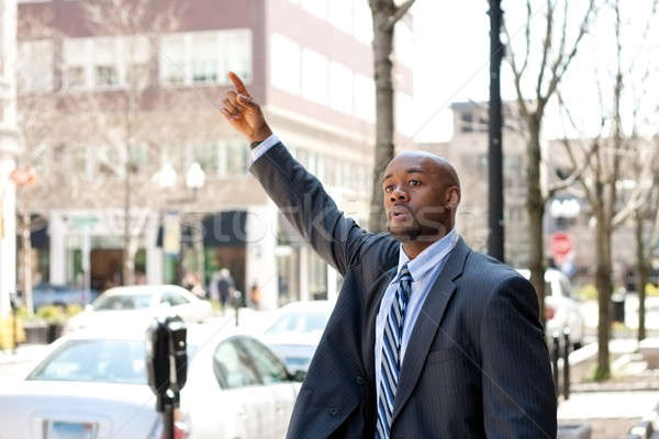 Business Man Hailing a Taxi Cab Stock photo © ArenaCreative