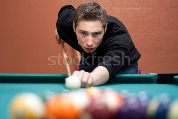 Young Man Shooting Pool Stock photo © ArenaCreative