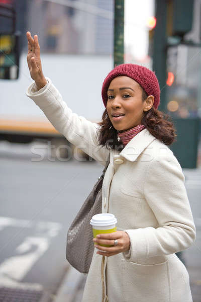 Woman Hailing A Cab Stock photo © ArenaCreative