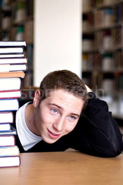 Stock photo: Overwhelmed Student with Piled Books