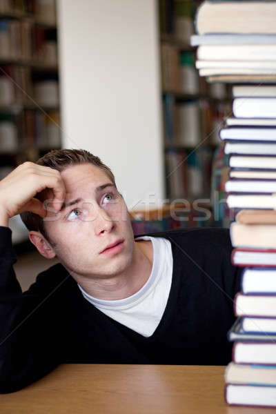 Stressed Student Looks At Book Pile Stock photo © ArenaCreative