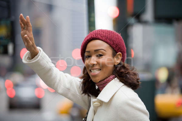 Woman Hailing A Cab Stock photo © ArenaCreative