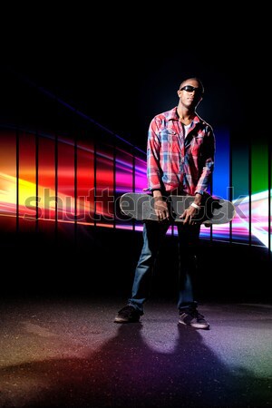 Cool skateboarder mec posant Photo stock © ArenaCreative