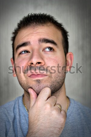Komoly elmélkedés fiatalember kéz áll gondolkodik Stock fotó © ArenaCreative