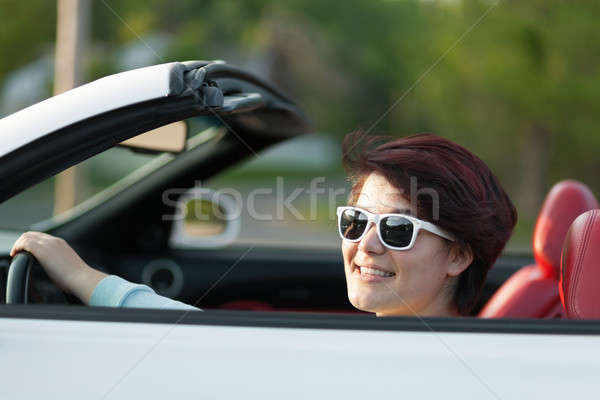 Conducción superior abajo retrato mujer sonriente coche deportivo Foto stock © arenacreative