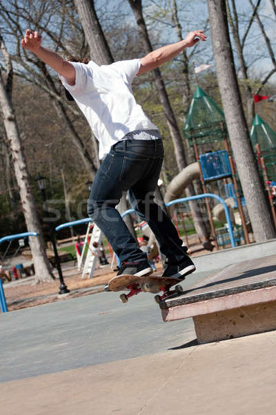 Homme skateboarder action coup Aller [[stock_photo]] © ArenaCreative