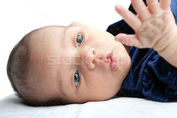 Cute Baby Curiously Looking at her Hand Stock photo © ArenaCreative