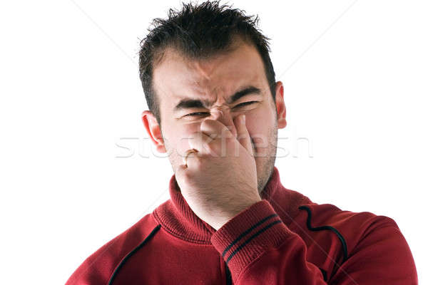 Szag fiatalember orr zárva arc férfi Stock fotó © ArenaCreative