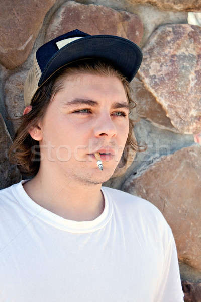 Young Man Smoking a Cigarette Stock photo © ArenaCreative