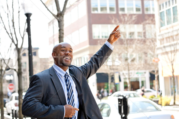 Homem de negócios táxi africano americano mão táxi cidade Foto stock © ArenaCreative