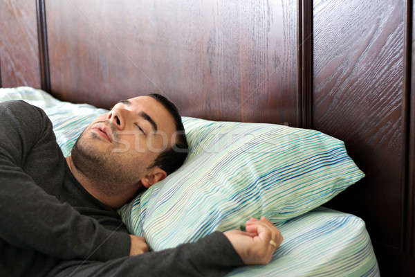 Man Sleeping In Bed Stock photo © ArenaCreative