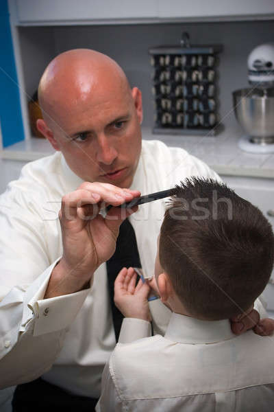 Stock photo: Father Helping Son Get Ready