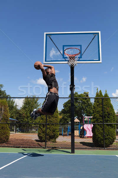 Stock photo: Basketball Player Dunking