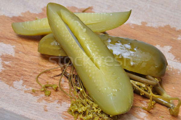 Quarters pickled cucumbers on a wooden worktop Stock photo © Arezzoni