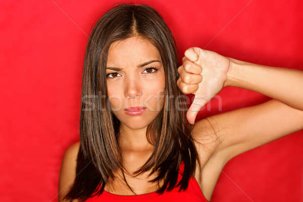 Boldogtalan hüvelykujjak lefelé nő kézmozdulat néz Stock fotó © Ariwasabi
