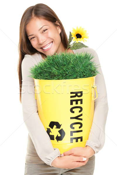 Woman holding recycling bin smiling Stock photo © Ariwasabi