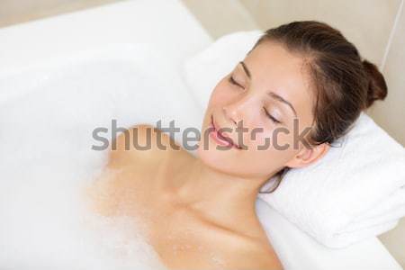 женщину расслабляющая ванны улыбаясь Сток-фото © Ariwasabi