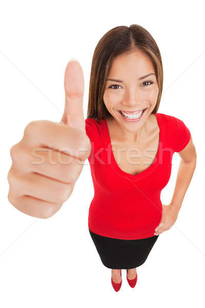 Thumbs up woman standing in full body length Stock photo © Ariwasabi