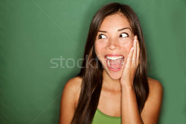 amazement - woman excited looking to the side Stock photo © Ariwasabi