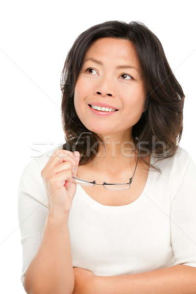 Gondolkodik középkorú ázsiai nő érett felfelé néz Stock fotó © Ariwasabi