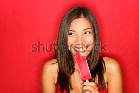 Woman putting makeup lipstick Stock photo © Ariwasabi