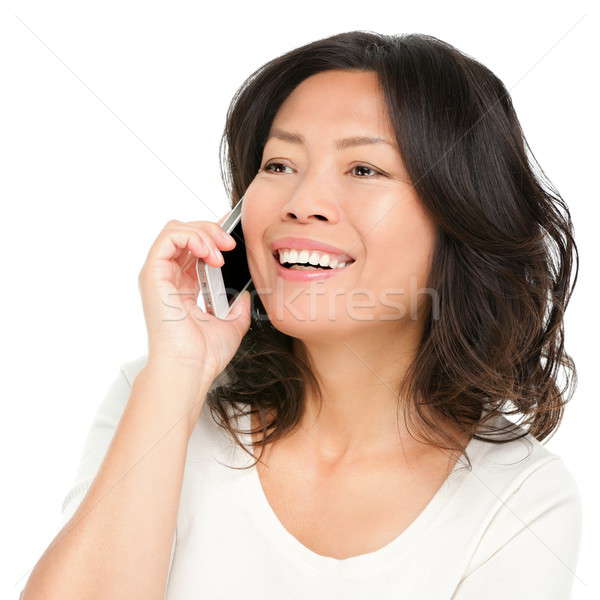 Stock photo: middle aged Asian woman on smartphone