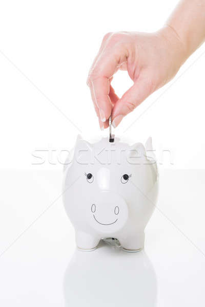 Ahorros equilibrio femenino mano moneda alcancía Foto stock © armin_burkhardt