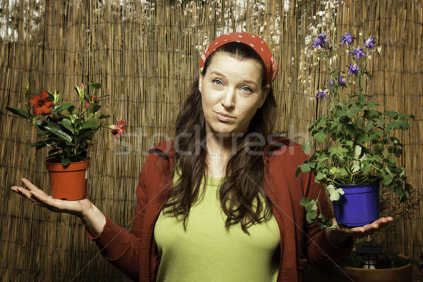 Mujer jardinería decisión dos flor Foto stock © armin_burkhardt
