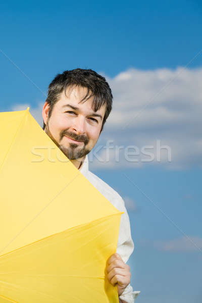 Férias homem amarelo guarda-chuva blue sky céu Foto stock © armin_burkhardt