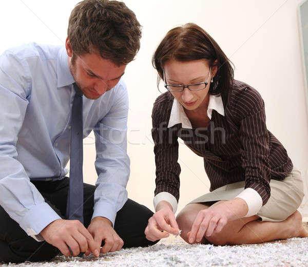 Stock photo: Man and Woman with file shredder