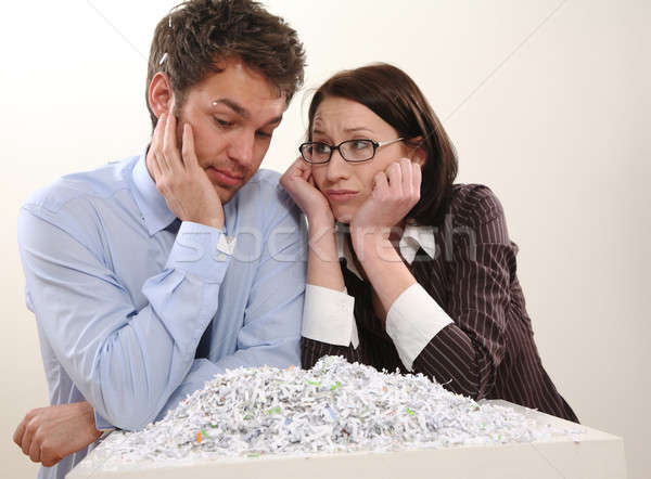 Stock photo: Man and Woman with file shredder