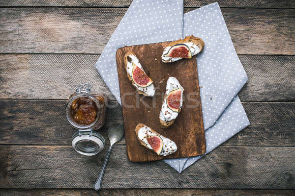 rustic style Bruschetta snack with jam and figs on napkin Stock photo © Arsgera